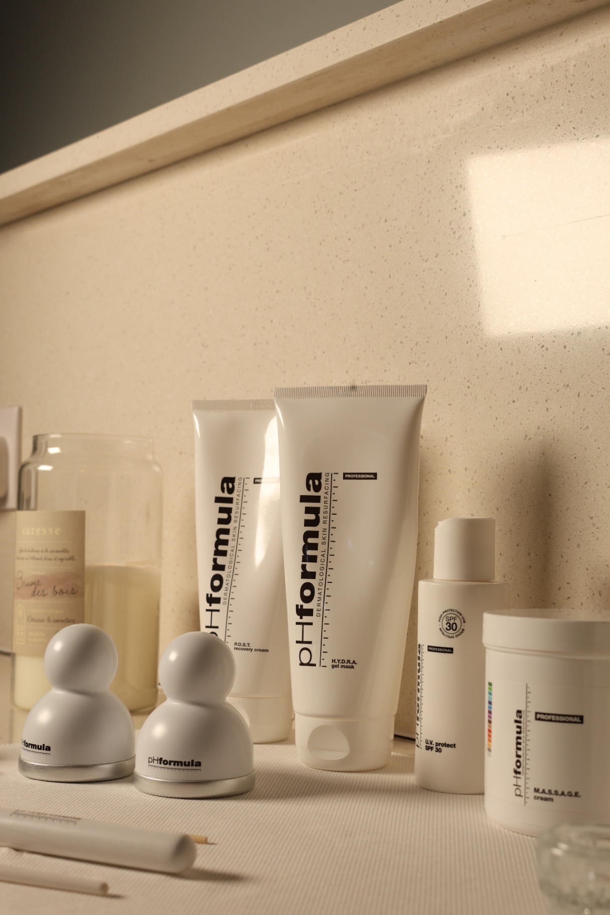 PH Formula recovery cream, gel mask and SPF arranged on counter